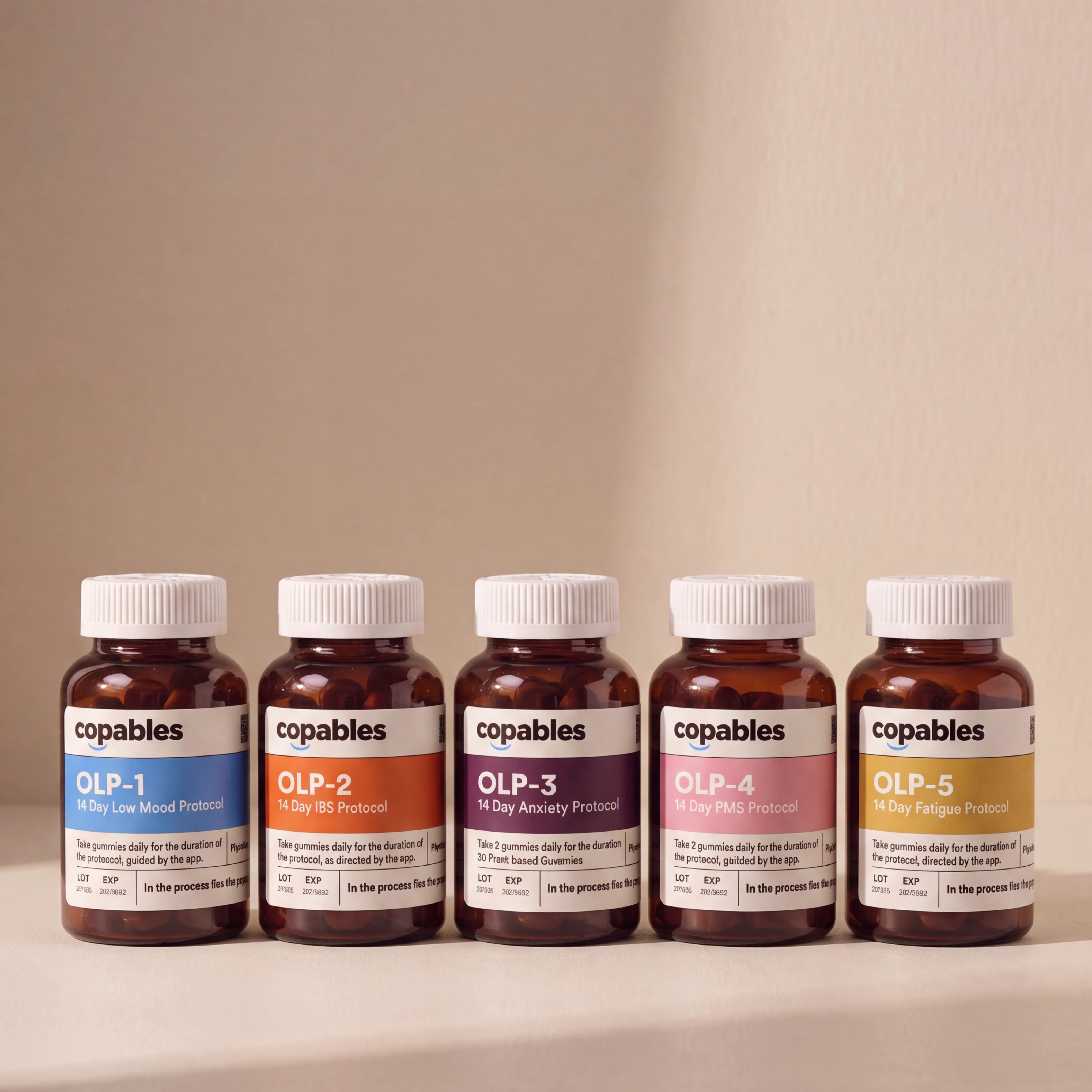 Five Copables OLP bottles — one per protocol — lined up on a soft cream backdrop.